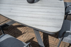 Edison Grey - Six Seater Triangular Dining Suite with Sergio Chairs - Light Grey Cushions